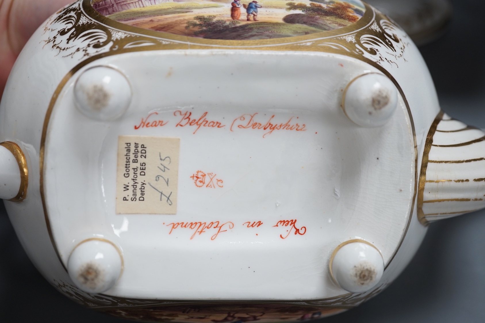 A Derby twin handled dish painted with a 'View in the Isle of Wight' and teapot and cover with two scenes, 'View in Scotland' and 'Near Belmar, Derbyshire c.1815